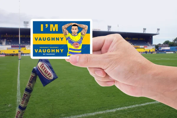 vaughny hand Hand holiding the Paul Vaughn warrington wolves fan sticker with an image of Paul Vaughn and the wording I'm Vaughny, Vaughny, Vaughny Vaughny